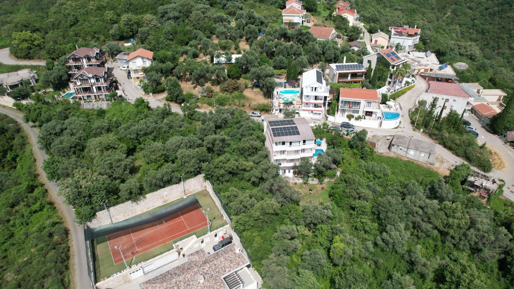 Plac 1597m2 sa Pogledom na More i Grad Bečići-Ivanovici - Amfora Real Estate