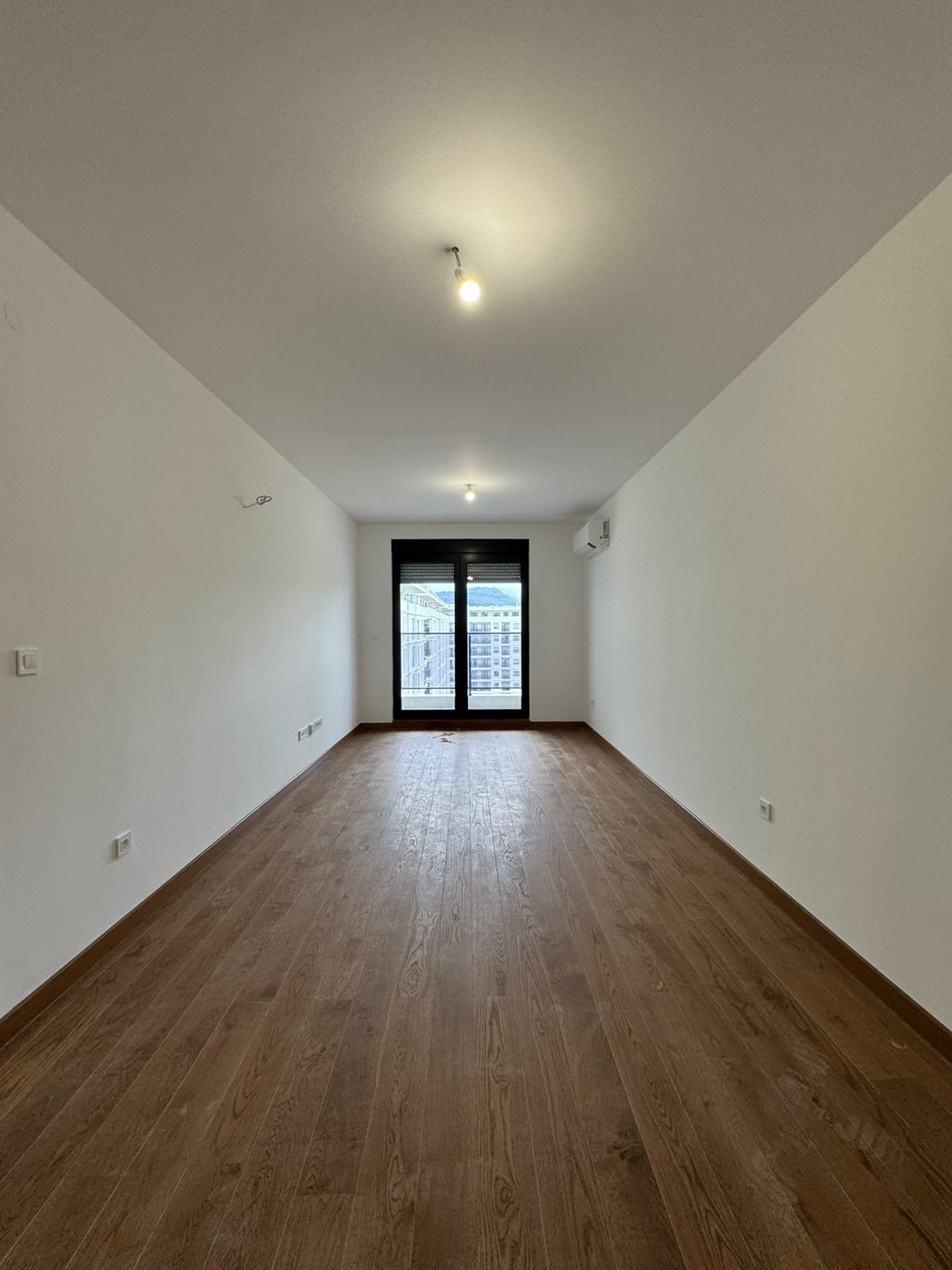 Izdavanje nenameštenog dvosobnog stana 64 m² sa garaznim mestom – Green Level 2, Podgorica (NA DUZI PERIOD) - Amfora Real Estate