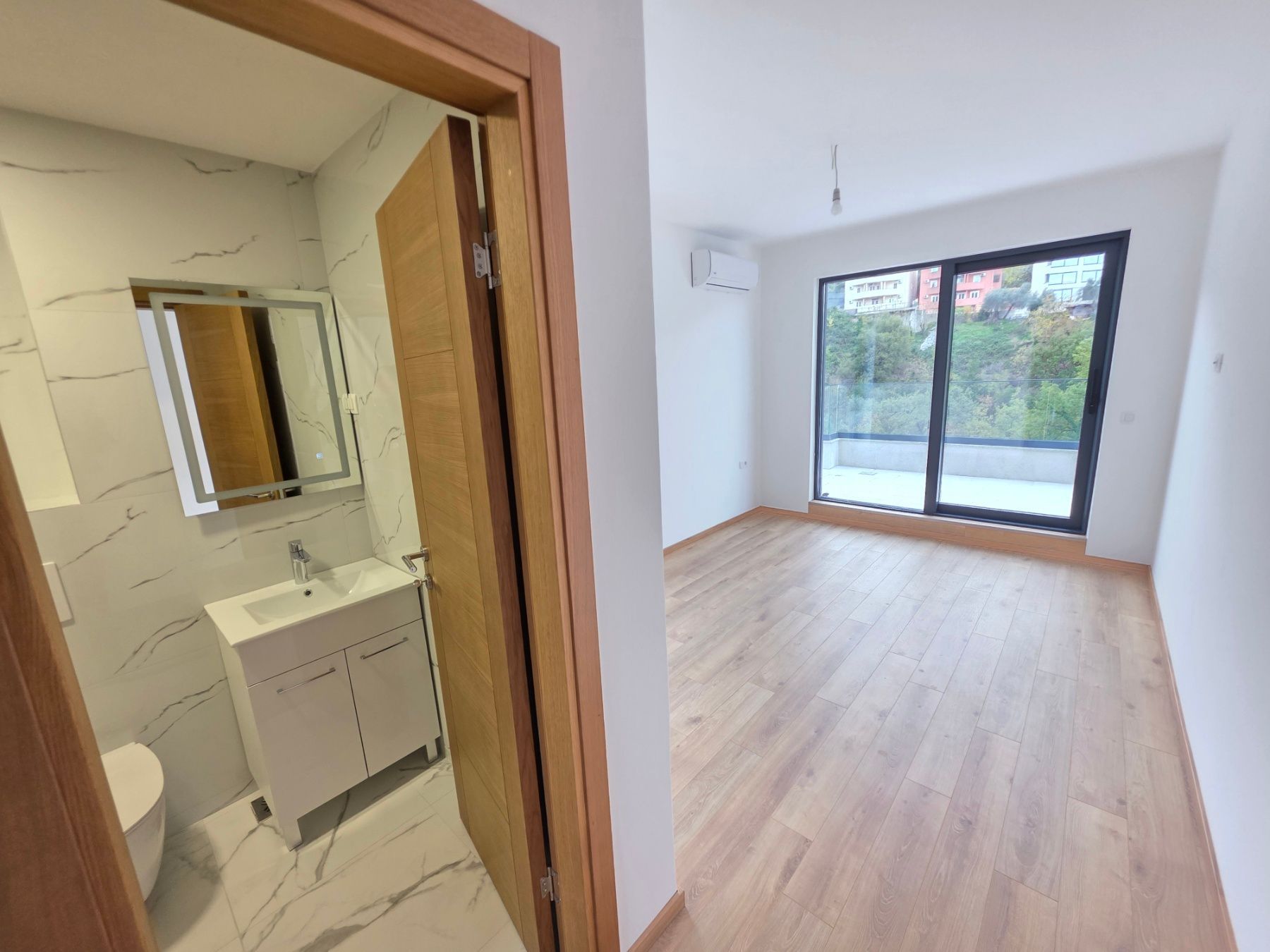 Prodaja dvosobnog stana 164m² u novogradnji sa pogledom na more,parkingom i oslobođenjem od poreza na prenos– Kamenovo, Budva - Amfora Real Estate