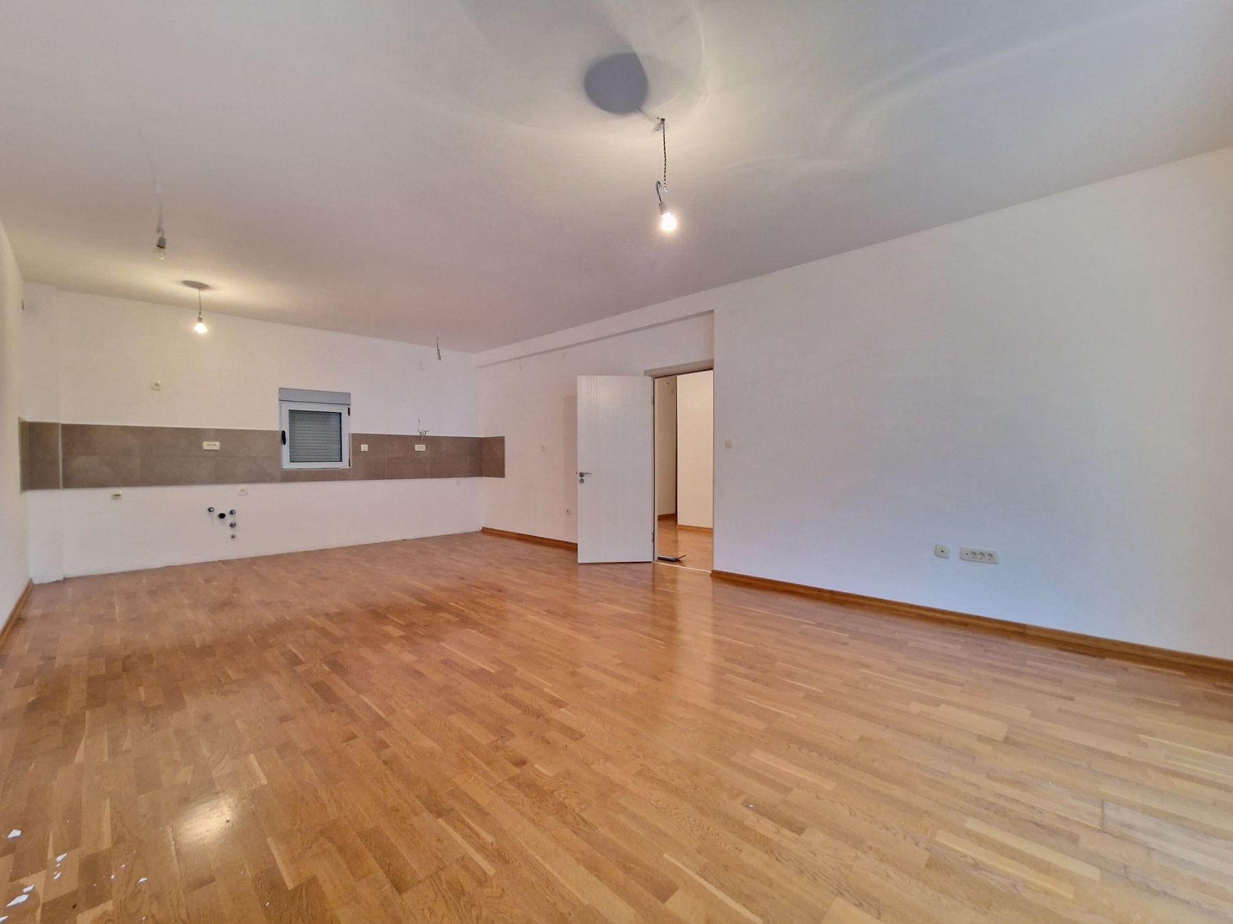 Nov dvosoban stan 83m2 sa bočnim pogledom na more,Rafailovići (Budva) - Amfora Real Estate