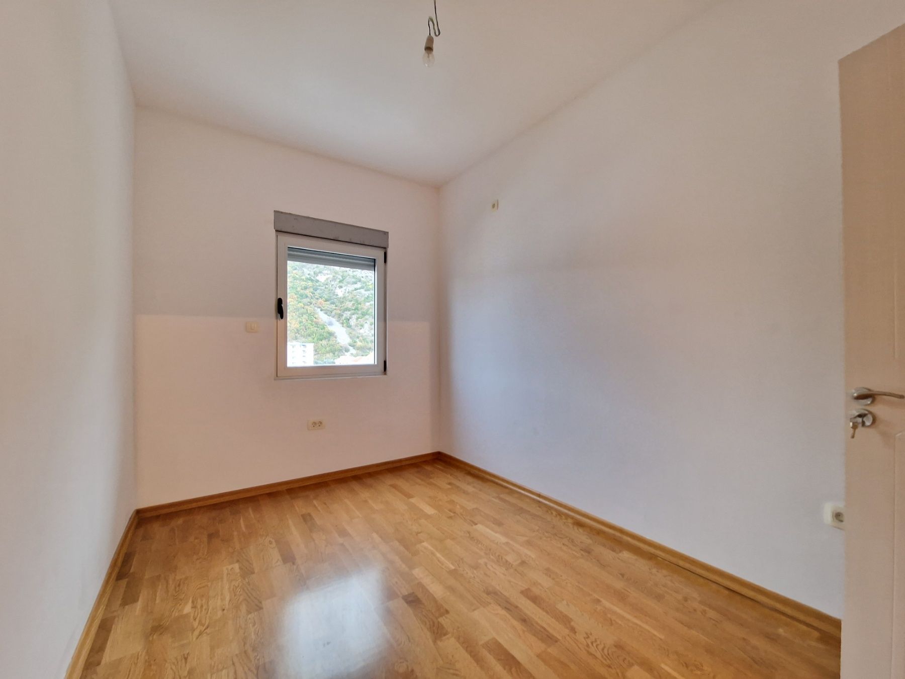 Nov dvosoban stan 83m2 sa bočnim pogledom na more,Rafailovići (Budva) - Amfora Real Estate